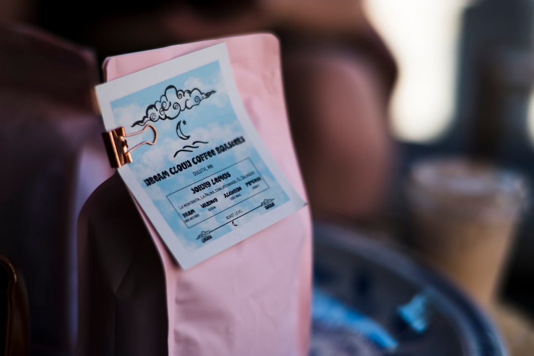 A label on the back of a pink chair