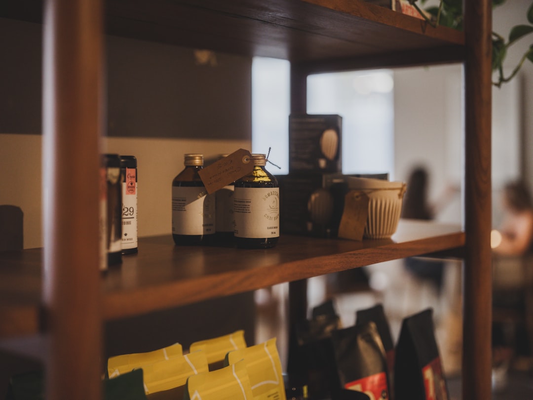 Bottles and items on a wooden shelf